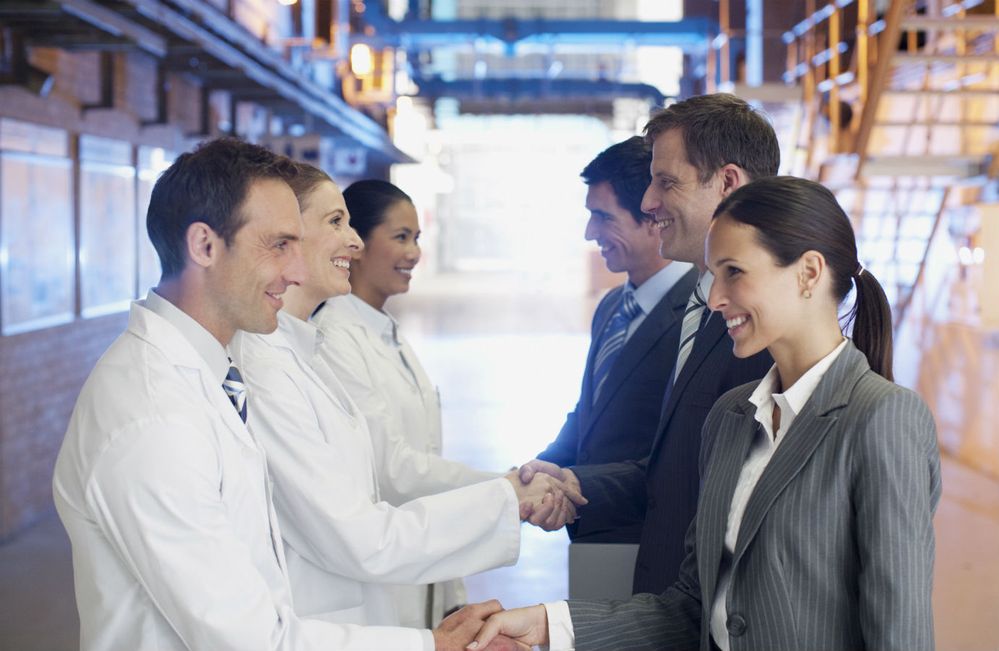 Chemists shaking hands with professionals, small.jpg